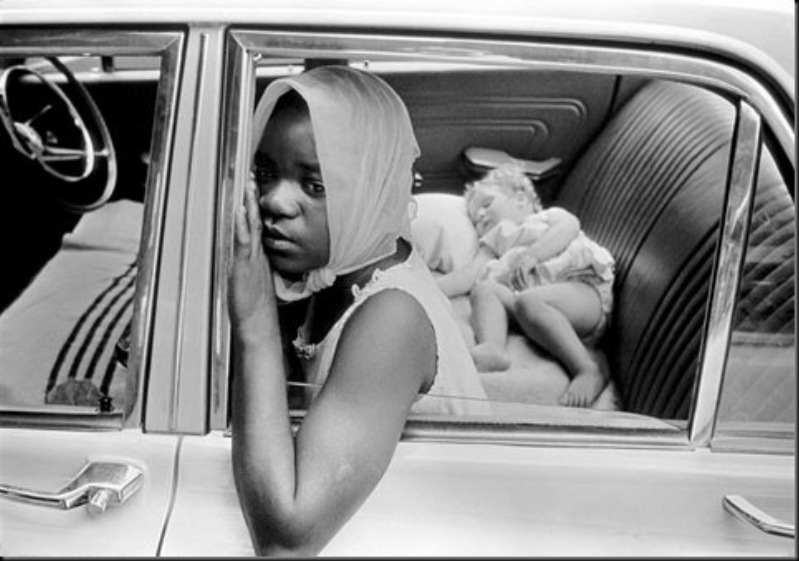 SOUTH AFRICA — A black woman looks after a white child, 1969.