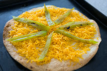 sprinkle cheese and arrange chiles on toasted tortilla