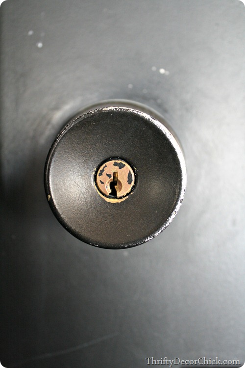 worn spray paint on door knob
