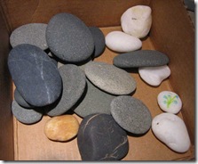 smooth black and grey pebbles from beach