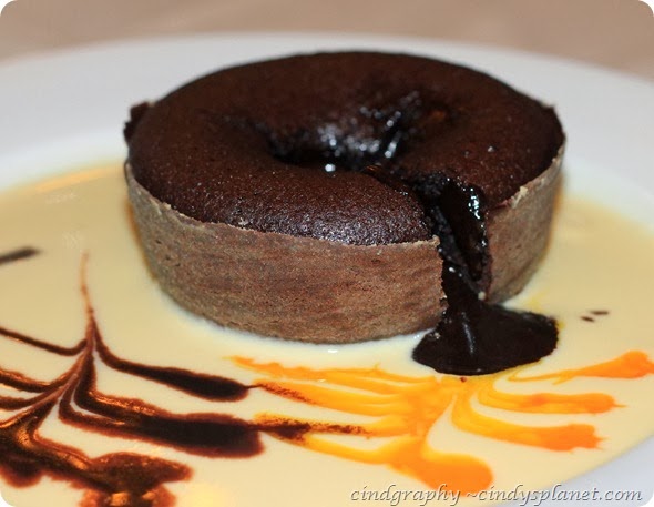 Cava Chocolate Dream Moist Chocolate Cake served in lime custard sauce molten