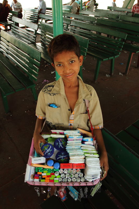 A Burmese Kid selling fast moving items on the Yangon-Dalla Ferry