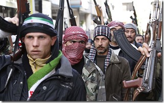 Syrian rebels march in a show of strength during a demonstration in Idlib, Syria, Friday, Feb. 10, 2012. (AP Photo)