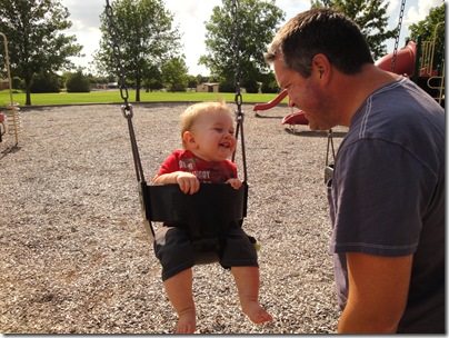 4.  Laughing and swinging with Daddy