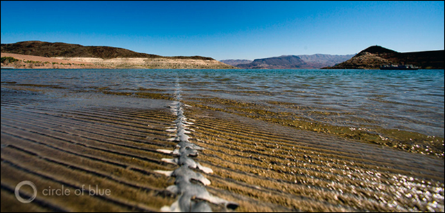 Water ripples across a boat ramp at Lake Mead, the reservoir formed by Hoover Dam. The lake dropped to a record low in July 2014, the consequence of a 14-year drought endured without a reduction in water use. Photo credit: J. Carl Ganter / Circle of Blue