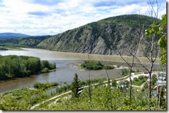 The confluence of the Klondike River (dark brown) and the Yukon River (light brown) in Dawson City, YT