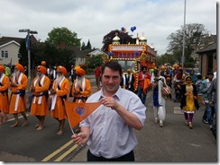 Jamie with flag at sikh festival