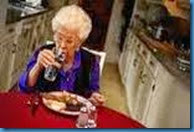 OLD WOMAN DINING ALONE