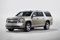 2015 Chevrolet Suburban in Champagne side view from New York reveal