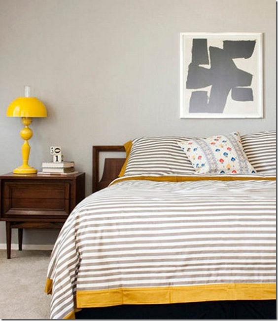 Modern bedroom with stripe bedding and a touch of yellow-design addict mom