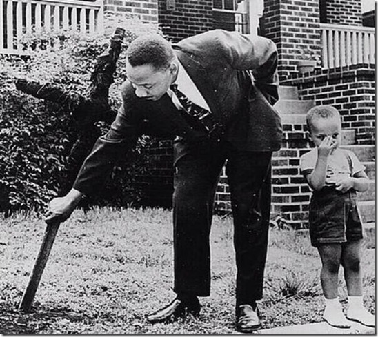 MLK Pulls Cross From Front Yard Lawn