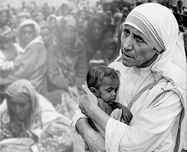 Mary Teresa of Calcutta holding a child