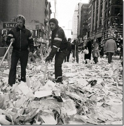 30 Jan 1981 --- Original caption: 1/30/1981-New York, NY- Two Department of Sanitation workers begin to sweep up the tons of confetti and ticker tape after the parade for the former American hostages on Broadway 1/30. --- Image by © Bettmann/CORBIS