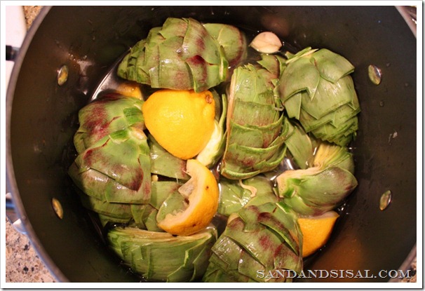 Artichokes in pot with lemon and garlic 