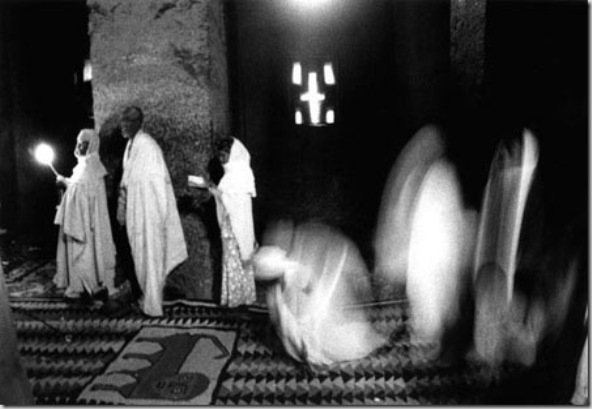 Inside Bet Madhane Alem temple at the end of a ceremony at Christmas. 
Each church has three or four entries: East doors only for priest, that to the South is only for women and that to the North only for men. Once inside men go to the left and women go to right (South).
