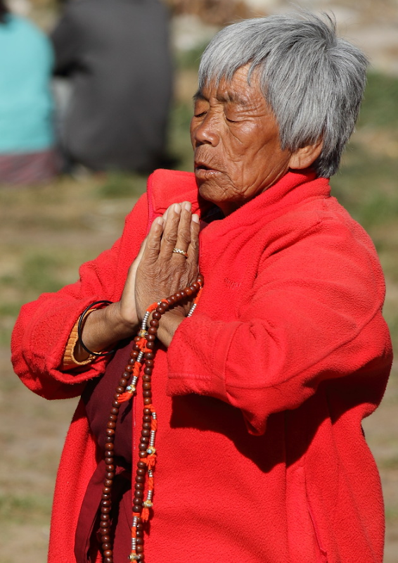 Bhutanese Woman in prayer