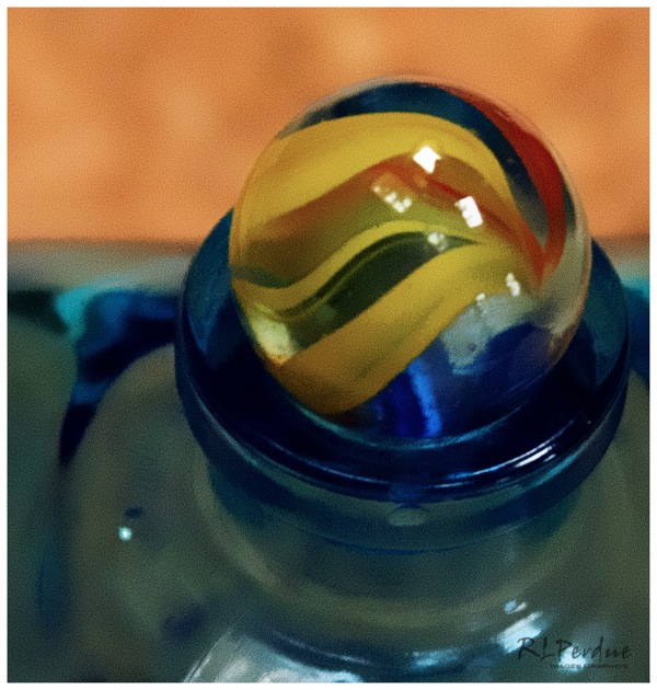 Marble on blue bottle
