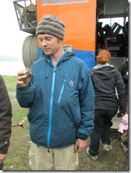Simons holds a crayfish at Lake Sevan