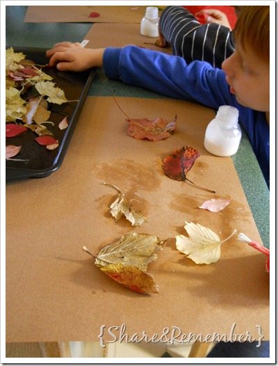gluing fall leaves on paper