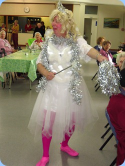Fiona, the fairy, using her magic wand and silvery shaker to conjure up some Christmas cheer