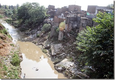 Katchi Abadi slum near unsanitary creek