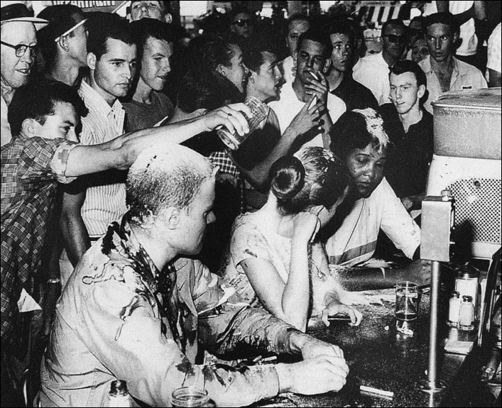 Lunch Counter Sit-In. Jackson Mississippi 1963 - Civil Rights demonstrators being taunted and covered with sugar mustard and ketchup.