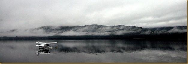 Sea plane on misty lake