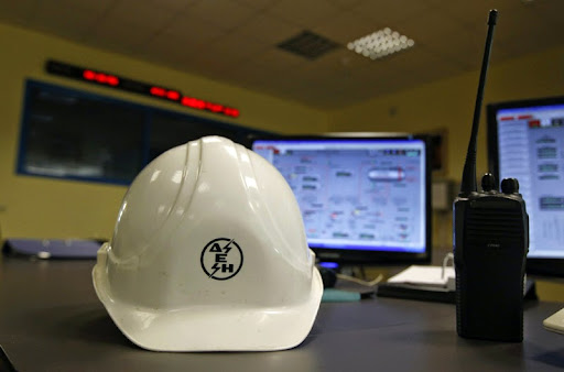 A Public Power Corporation's (PPC) protective helmet is seen on a desk inside a control room of the natural gas-fired power station at Lavrio town southeast of Athens May 13, 2011. Greece's cash-strapped government, which owns 51 percent of PPC, plans to sell as much as 17 percent in the company next year as part of its 50 billion euro privatisation drive to pay down debt and avoid bankruptcy. PPC's labour union GENOP opposes the move and threatens rolling 48-hour strikes to prevent it.    REUTERS/Yiorgos Karahalis  (GREECE - Tags: BUSINESS ENERGY POLITICS)