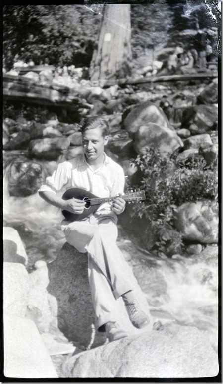 Arthur Iverson playing a mandolin