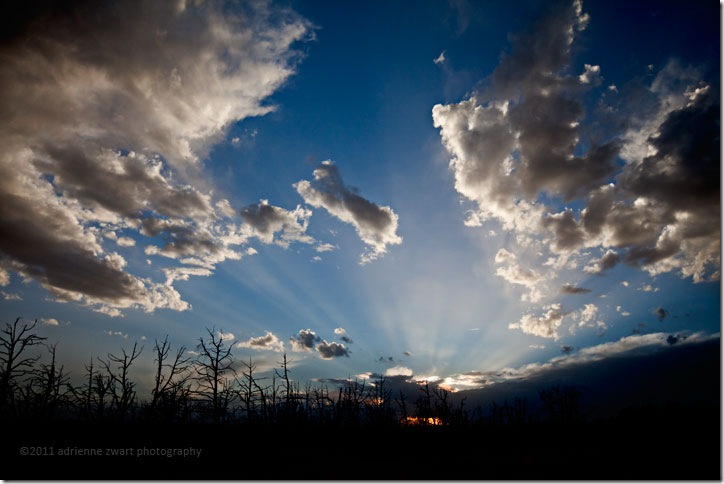 Sunset at Mesa Verde sun setting in cloudy sky - Photo copyright Adrienne Zwart