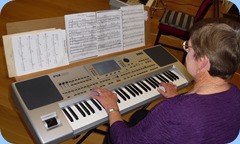 Pam Rea playing her Korg Pa80
