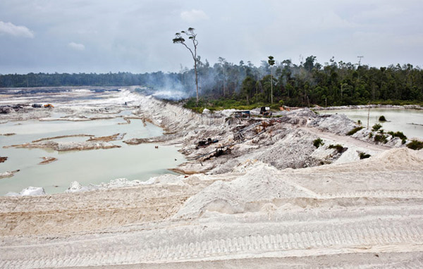 Pools of stagnant water and the cratered landscape of this PT Timah tin mine have replaced forest and farmland. Mobile device giant Samsung has admitted to using tin sourced from the controversial mining operation on the Indonesian island of Bangka, where unregulated mining kills 150 miners a year and causes substantial environmental damage Photo: Ulet Ifansasti