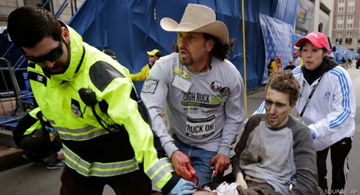 Gravely injured Jeff Bauman rescued by paramedics and everyday hero Carlos Arredondo.