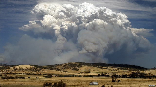 Smoke billows high into the atmosphere as fires rage across Tasmania, 6 January 2013. A 'dome of heat' pushed temperatures above 40 degrees, creating 'catastrophic' fire conditions, called 'the worst fire danger the state has ever faced'. Reuters