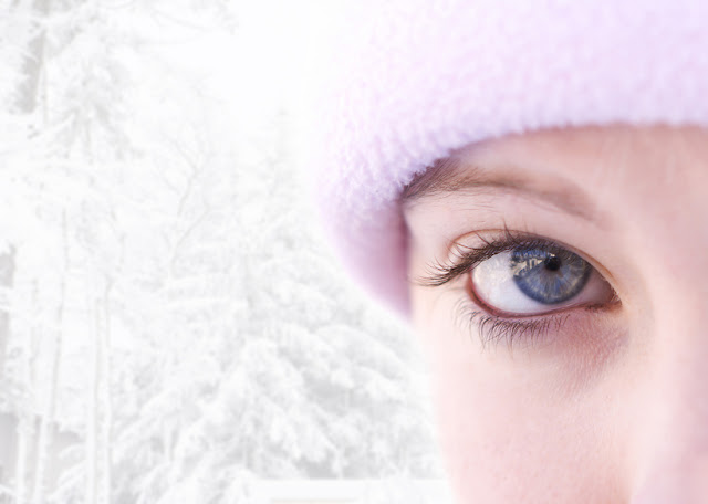 Close-up of a blue eyed female outside in winter(focus on eye)