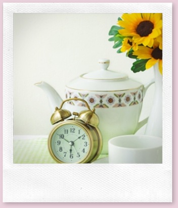 Picture of a tea pot, alarm clock and a cup