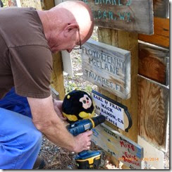 Bumble helping Grandpa attach the sign