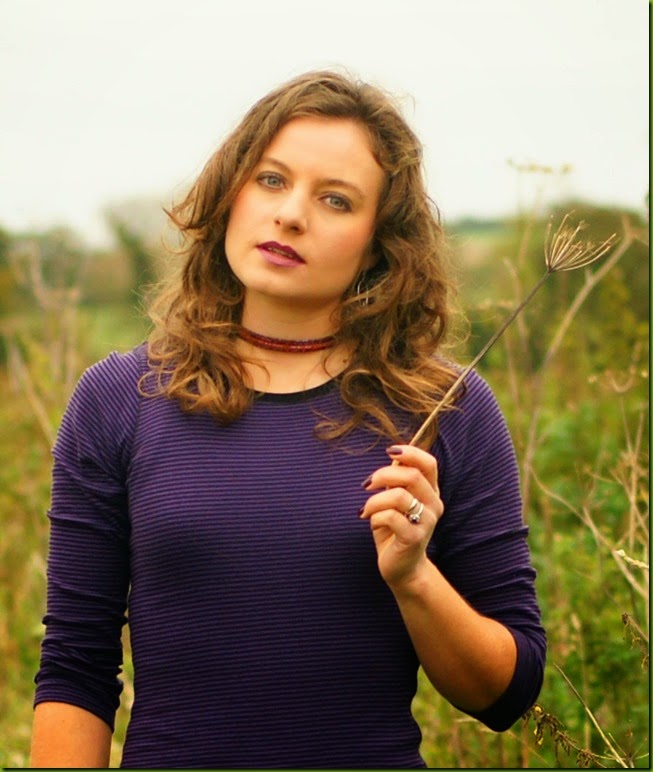 purple bodycon dress in a field
