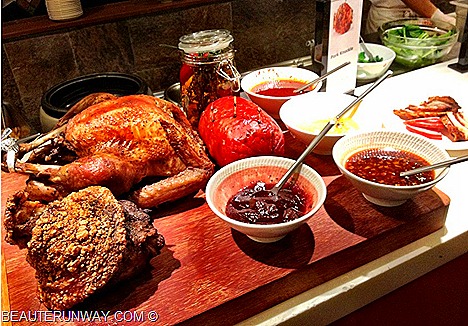 Plaza hotel Brasserie Beach Road buffet crispy crackling Pork Knuckles in Asian inspired Spicy Sauce and Red Wine Sauce American favourites Roasted Honey Glazed Ham with Pineapple Cranberry Sauce, Roasted Turkey Sausage Meat