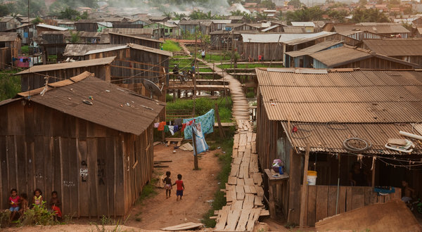 Cities encroach on the Amazon rainforest. The torrid growth is visible in places like Parauapebas. On the outskirts, slums stretch to the horizon and houses continue to go up. Lalo de Almeida for The New York Times