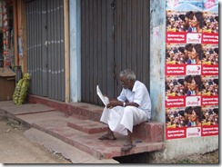 An-elderly-person-eagerly-reads-the-Uthayan-Tamil-newspaper-in-the-morning