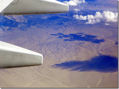 We're in the air!!  The Arizona desert with clouds and cloud shadows.