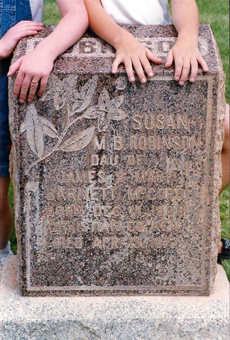 Sarah & Annie's hands on Susan Robinson's grave. 