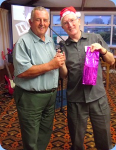 Committee Member, Ken Mahy, presented the Club President, Gordon Sutherland, with a gift to celebrate his 65th Birthday and as an appreciation of the hard work committed to the Club to keep it vibrant. Photo courtesy of Peter Littlejohn.