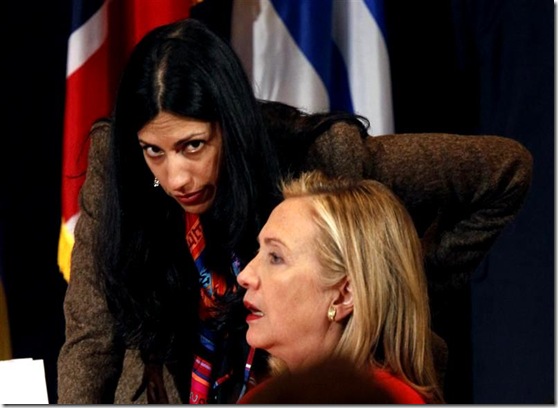 U.S. Secretary of State Hillary Clinton talks with her deputy chief of staff, Huma Abedin, during the Open Government Partnership event in New York September 20, 2011. REUTERS/Kevin Lamarque