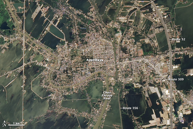 On 1 December 2011, dark brown-green floodwater surrounds the city of Ayutthaya, Thailand, obscuring boundaries between agricultural fields. NASA Earth Observatory image created by Robert Simmon, using EO-1 ALI data provided courtesy of the NASA EO-1 team