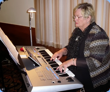 Barbara McNab played the arrival music and a mini-concert on her Yamaha Tyros 4. Photo courtesy of Dennis Lyons.