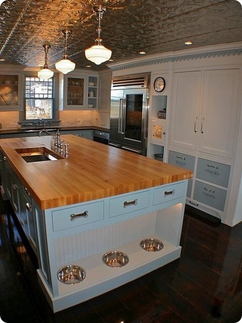 Kitchen island with built-in pet feeding station