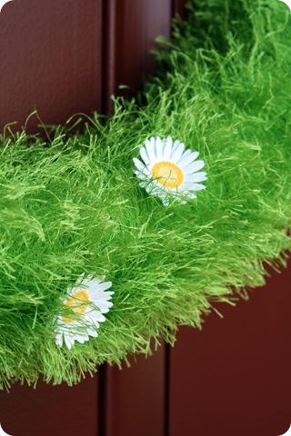 green grass wreath with flowers