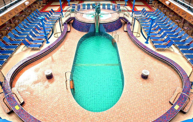 On cool days the Ulysses Pool — one of four swimming pools on Carnival Miracle — and its whirlpool are covered by a retractable glass roof. 